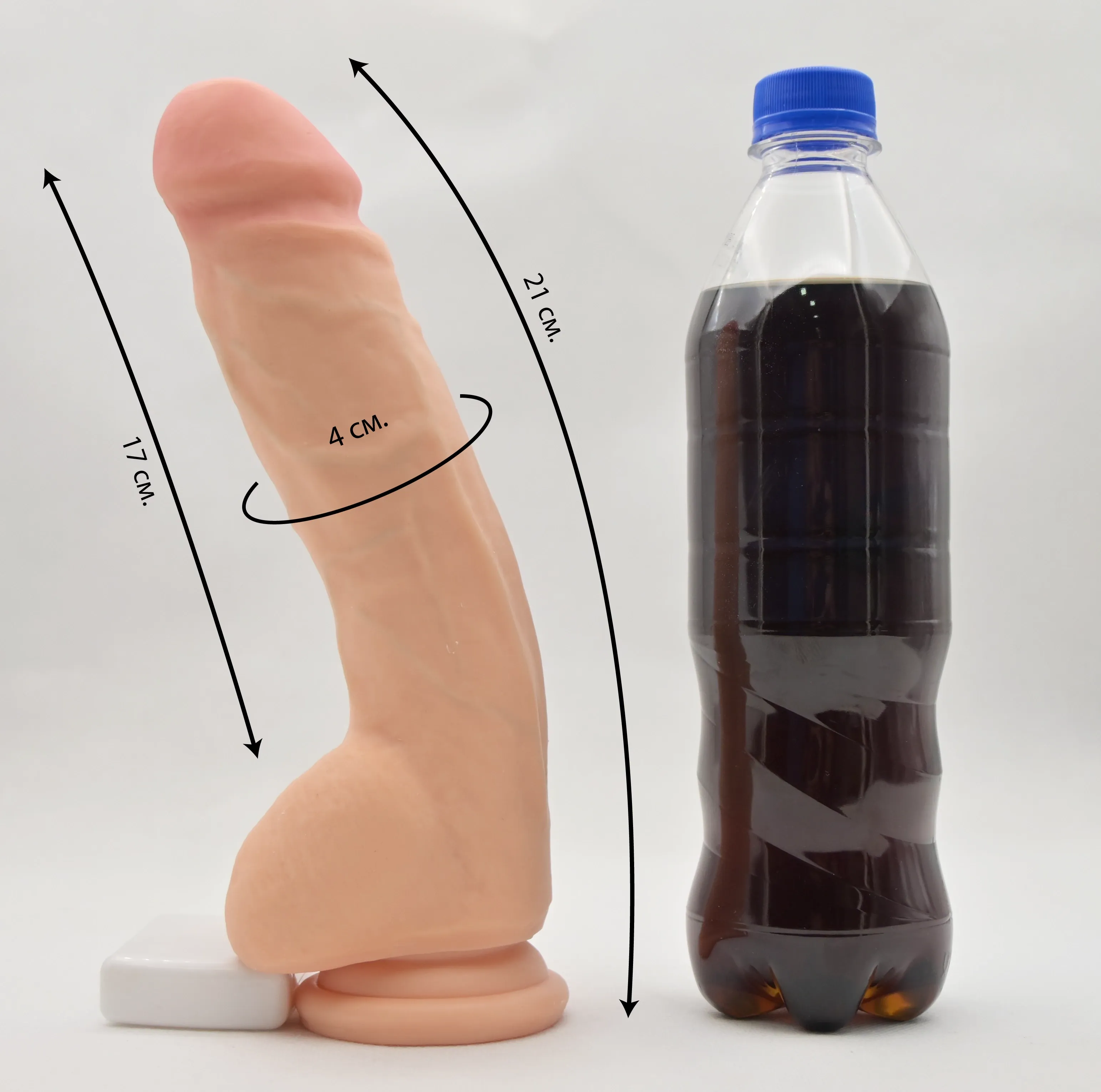 Размер и сравнение Real Stick Elite Marc с бутылкой колы